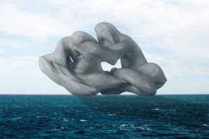 This work capture the sculpture "Sulla Spiaggia" created by Natalino Sammartin. The sculpture is on the ocean.